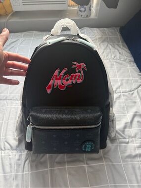 MCM Black Backpack with Pink and Teal Logo
